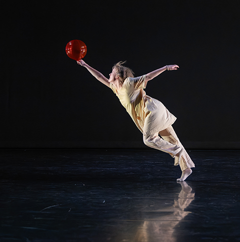 modern dancer dancing with a ball on their fingertips