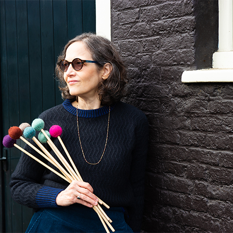 woman holding marimba mallets