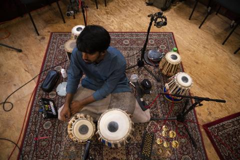 man playing tabla drums