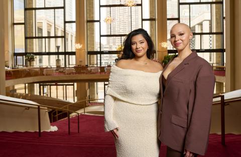 Alums Gabby Reyes and Melanie Bacaling in front of a window