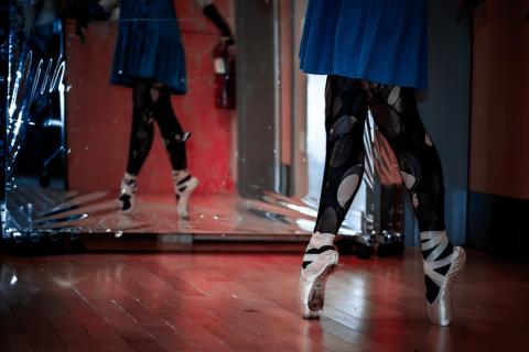 close up of person on pointe with mirror reflection